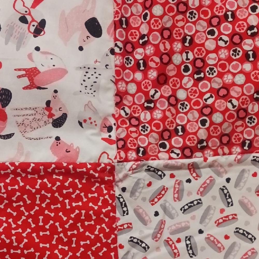 Red and White Dog Patterned Quilt